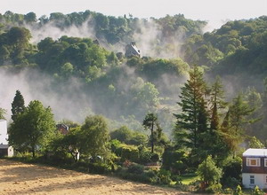 early mist in the sun across to the castle